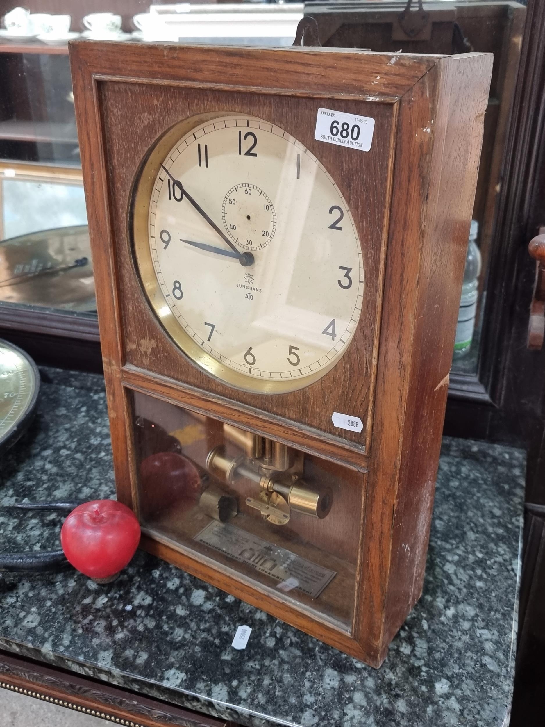 A fantastic original vintage Junghans ATO electrical wall clock made in