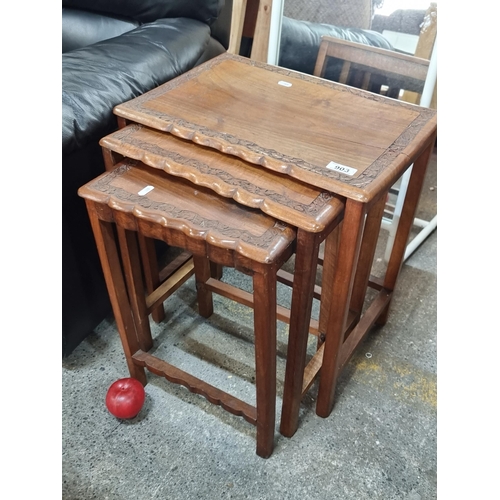 903 - Three charming wooden vintage nesting tables. Very pretty pieces with scalloped edges and an elegant... 