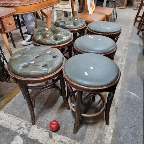 905 - A fantastic set of six traditional low pub stools. All boasting bentwood bases, and green leather to... 