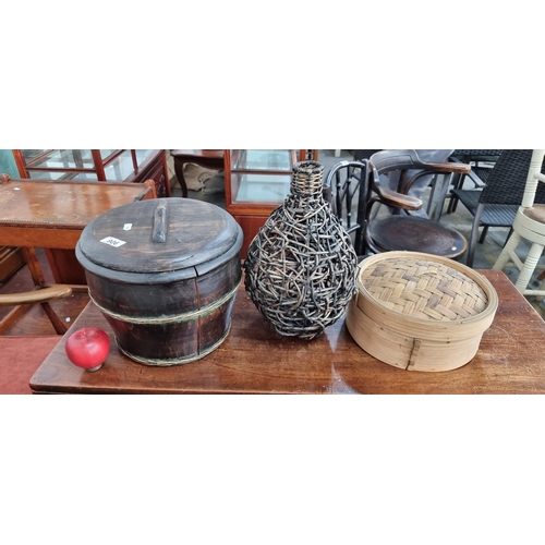 906 - A trio of traditional East Asian homeware items, comprising of a gorgeous antique lidded Chinese wat... 