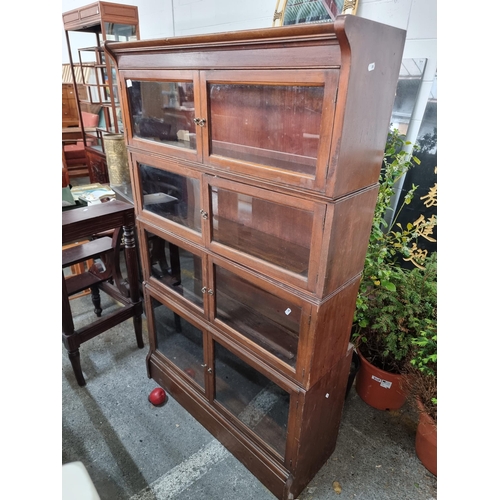 921 - Star lot : A handsome antique mahogany Barristers shelving display unit with four stackable tiers th... 