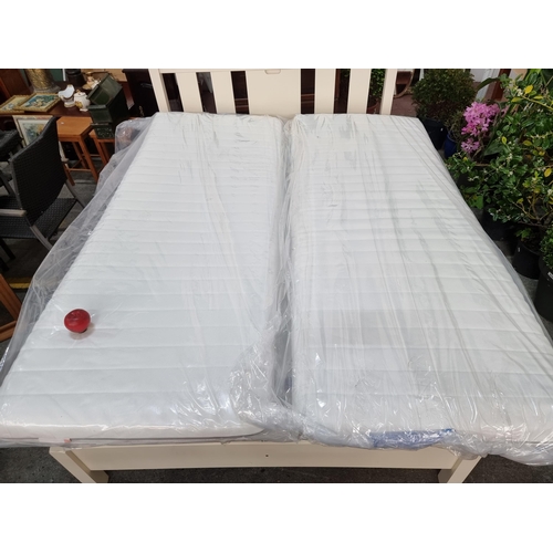 923 - Two single bed foam mattress toppers in sealed packaging.