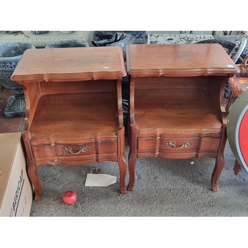 930 - A pair of Mid Century cherrywood bedside cabinets from the American Permacraft furniture company. Wi... 