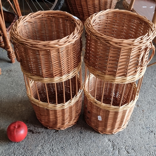 932 - A pair of wicker umbrella stands with ring handles and two-toned detailing. H40cm  Super new from a ... 