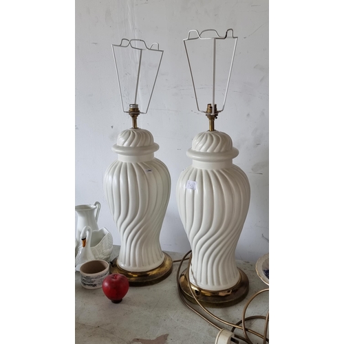 940 - Two heavy tall table lamps with ceramic stems in the form of ginger jars, held heavy brass toned bas... 