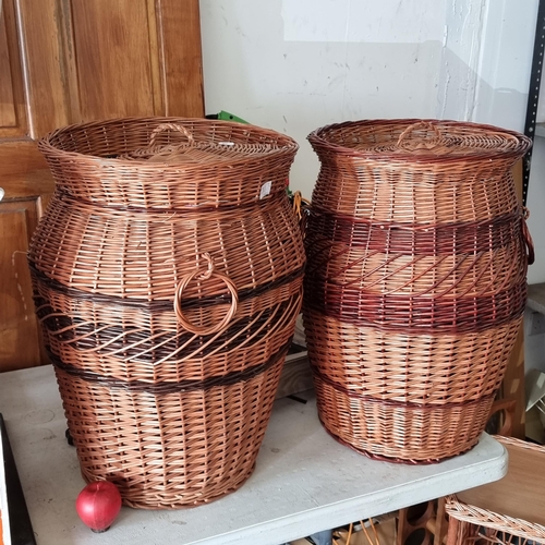 943 - Two large lidded wicker baskets with handles to side and fabric lined. Perfect for laundry.  Super n... 