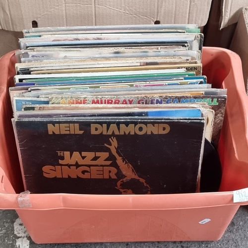 952 - A large box containing 61 vintage vinyl records including Chris De Burgh's 