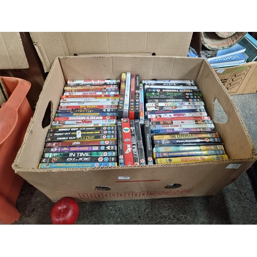 956 - A box containing approximately 60 DVD's including classic movies such as 