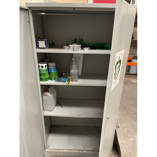 978 - A two door steel cabinet with shelves inside.  Items from this vendor to be collected first week in ... 