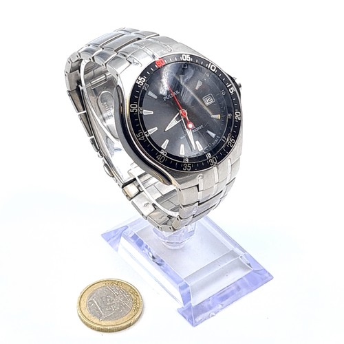 565 - A handsome example of a gentleman's Pulsar NPWA01 analogue wrist watch, set with a black face, lumin... 