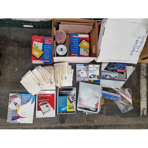 961 - A large box containing a huge number office supplies including postage envelopes, folders, laminatin... 