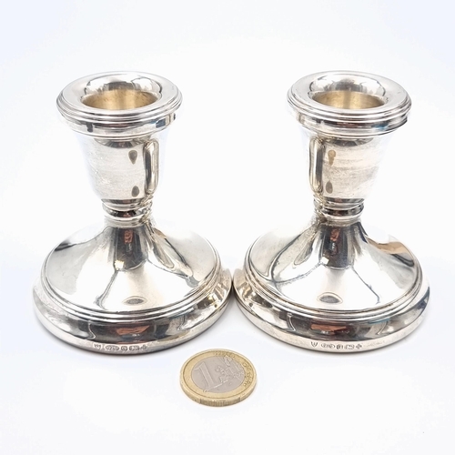 10 - An attractive duo of sterling silver candle holders (filled),  featuring nice clean bodies and gradu... 