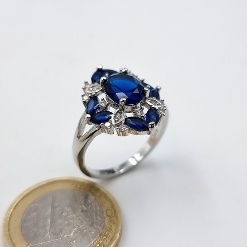 2 - A truly fabulous cocktail sterling silver ring, set intricately with deeply hued blue gem stones and... 