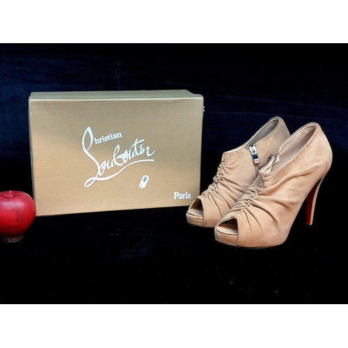 252 - A pair of Christian Louboutin style open toe ankle boots in a soft brown suede. A stylish pair of sh... 