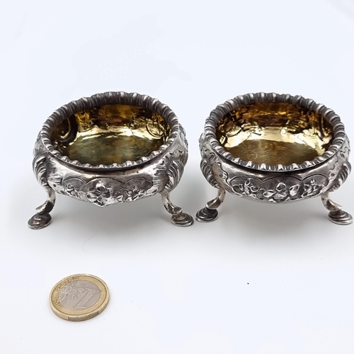28 - Star Lot: A beautiful pair of Victorian cauldron style antique sterling silver salt cruets, each fea... 