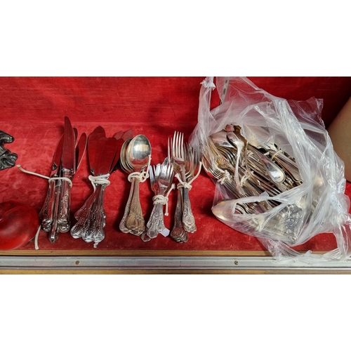 384 - A large collection of approx. 50 pieces of cutlery including spoons, forks, knives, teaspoons and mu... 