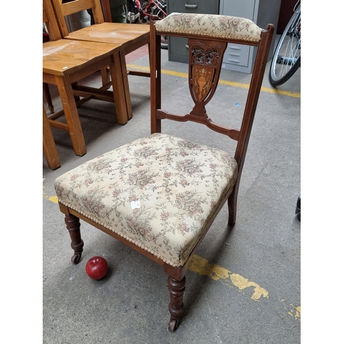 417 - A very elegant Edwardian occasional chair. Featuring a pierced backrest with marquetry inlay. Uphols... 