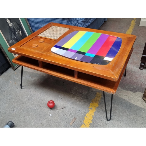 432 - An whimsical two-tier TV / Coffee table in a retro inspired design. Featuring a teak wood top with i... 