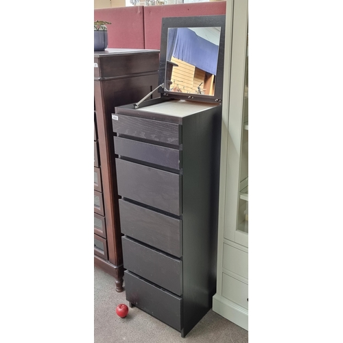 438 - An excellent example of a tall boy storage unit. Featuring seven graduating drawers and surmounted b... 