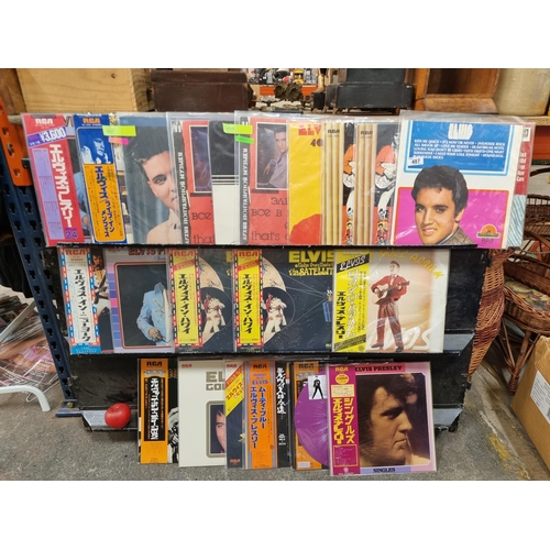 487 - A selection of twenty-three vinyl albums concerned with the music and performances of Elvis Presley.... 