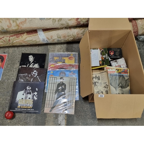 488 - A mixed box of Elvis Presley collectables and memorabilia. Including vinyl albums, books, posters, f... 