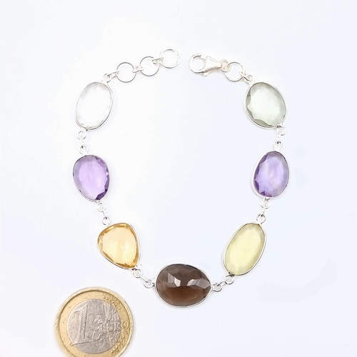 51 - A beautiful Citrine and Amethyst sterling silver bracelet, set with a lobster clasp and stamped 925.... 