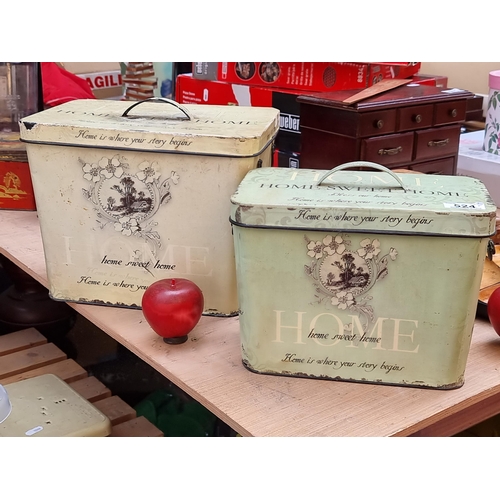 524 - Two matching charming kitchen metal containers reading 'Home Sweet Home' in yellow and apple green s... 