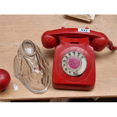 533 - Two vintage items including a GEC red rotary phone along with a charming glass jelly/blancmange moul... 