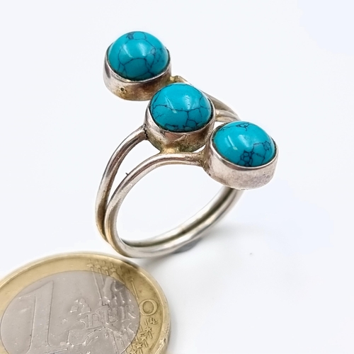 575 - A stunning three stone Turquoise sterling silver ring. Ring size: R. Weight: 3.65 grams.