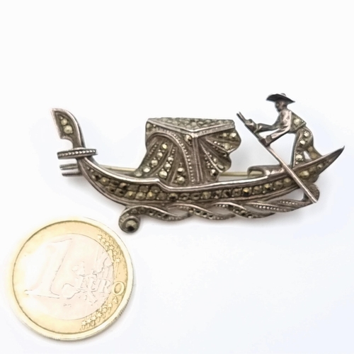 591 - An attractive brooch, in the form of a Gondola with a Gondolier. This example is set in sterling sil... 