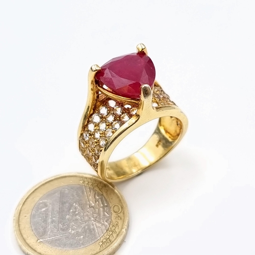 601 - Star Lot: An exceptional Ruby and Diamond silver gilt cocktail ring, featuring a generous central Ru... 