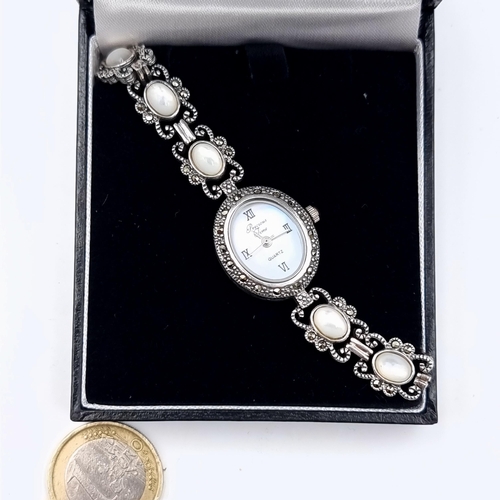 603 - A very attractive hallmarked silver ladies cocktail watch, set with ten Moonstones and Marcasite flo... 