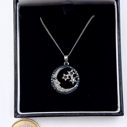 609 - A super vintage Diamond and Sapphire stone pendant, depicting a crescent moon and stars. The Diamond... 