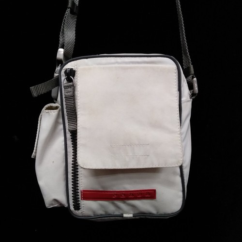 402 - A 1990s Prada travel crossbody bag. Model 4VA337 Mat Y47 and designed in the white colour-way with a... 