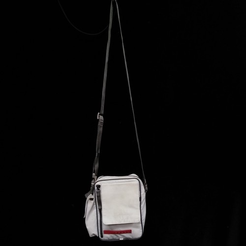 402 - A 1990s Prada travel crossbody bag. Model 4VA337 Mat Y47 and designed in the white colour-way with a... 