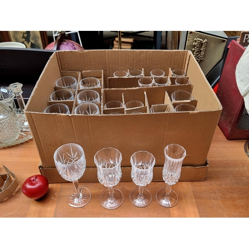 610 - A box containing a collection of 28 good quality stemmed glasses including wine glasses and champagn... 