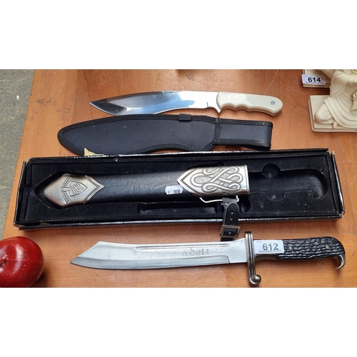 612 - Two good quality knives including a German example in a leather sheath with embossed hardware and pr... 