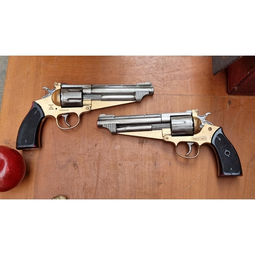 613 - Two vintage German made toy cap guns by Wicke from the cartoon 'Lucky Luke'.