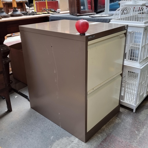 641 - A Bisley filing cabinet with two drawers to front. Keys included. In a classic brown and tan finish.