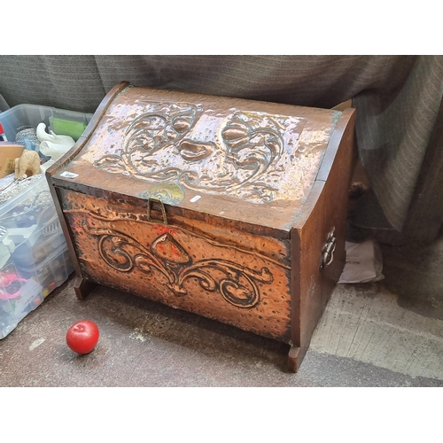 646 - A fabulous Art Nouveau 1890s  coal chest with hammered copper tooled plating to front and lid. Fitte... 