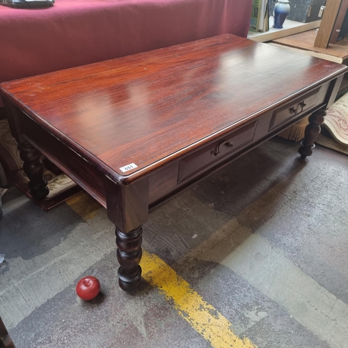 651 - Star Lot : A handsome good quality mahogany coffee table with two drawers to front boasting brass dr... 