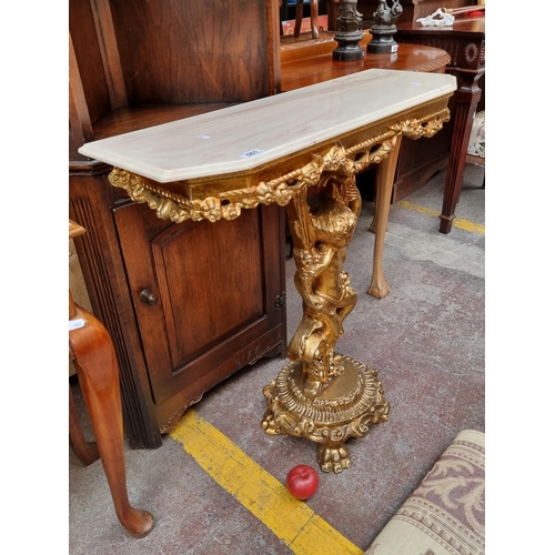 661 - Star Lot : A striking Baroque style console table with highly ornate gilt stem consisting of a cheru... 