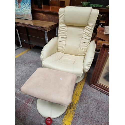 677 - A very comfortable armchair with swivel base, high back and upholstered in a cream leather fabric. F... 