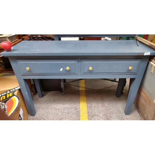 696 - A handsome, nicely proportioned console table with two pull out drawers, a contemporary charcoal fin... 