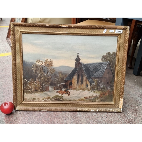 702 - A lovely antique original oil on canvas painting showing a wintery landscape scene of a village chap... 