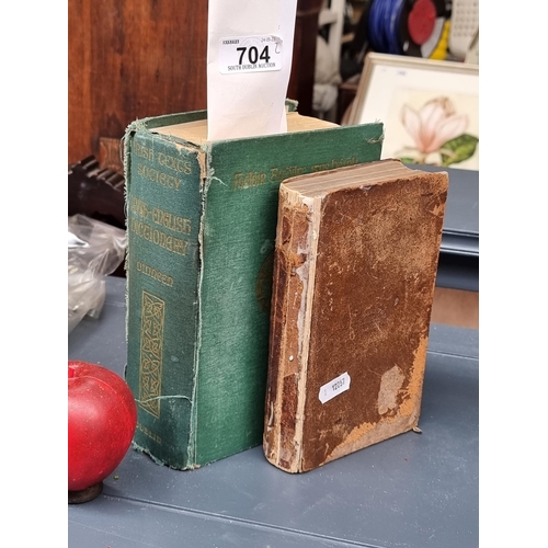 704 - Two hardback books including an antique Irish Bible produced by the British and Foreign Bible Societ... 