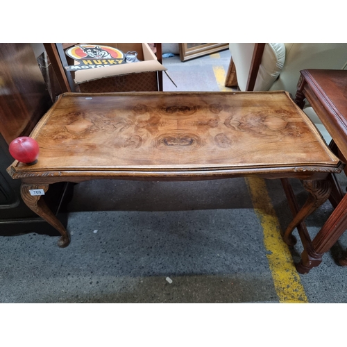 709 - A delightful burled walnut coffee table with raised rim to top, all held on cabriole legs boasting a... 