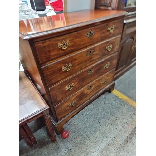 712 - Star Lot : A fabulous Georgian golden mahogany  chest of drawers with four drawers to front boasting... 