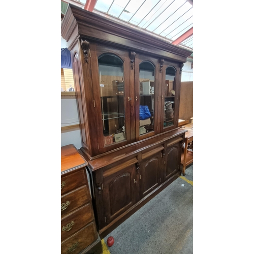 713 - Star lot : A large and impressive Mahogany triple dresser with three glass fronted display cabinets ... 