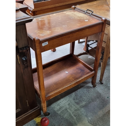 715 - A lovely antique early 20th century wooden drinks trolley with removable tray to top boasting beaded... 